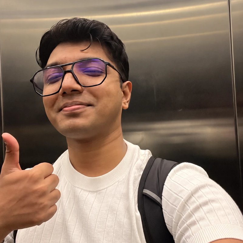 Sumedh Ingle giving a thumbs-up in a lift